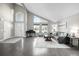 Spacious living room with high ceilings, a piano, and modern furniture arrangement at 8762 Mourning Dove Ln, Highlands Ranch, CO 80126