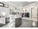 Comfortable home office featuring dual monitors, open shelving, and organized storage solutions at 8762 Mourning Dove Ln, Highlands Ranch, CO 80126