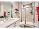 Modern bathroom with glass shower, white vanity, and sleek fixtures for a clean, contemporary feel at 9636 Bennett Peak St, Littleton, CO 80125