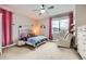 Charming ' bedroom with a cozy bed, sitting chair, and fun decor at 9636 Bennett Peak St, Littleton, CO 80125