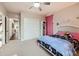 Cozy bedroom featuring a ceiling fan and plush unicorn themed bedding in a home for sale at 9636 Bennett Peak St, Littleton, CO 80125