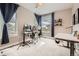 Well-appointed bedroom with a desk area, ample natural light, and contemporary decor at 9636 Bennett Peak St, Littleton, CO 80125