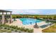 Large community pool with lounge chairs, lifeguard stand, and well-maintained landscaping at 9636 Bennett Peak St, Littleton, CO 80125