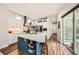 Bright, open kitchen features a large island, stainless steel appliances, and ample cabinet space at 9636 Bennett Peak St, Littleton, CO 80125