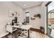 Cozy home office with a modern desk, natural light, and stylish decor at 9636 Bennett Peak St, Littleton, CO 80125