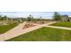 Community park featuring green spaces, walkways, playground, and picnic areas at 9636 Bennett Peak St, Littleton, CO 80125