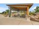 Covered picnic area in the community park featuring picnic tables and a barbecue grill at 9636 Bennett Peak St, Littleton, CO 80125