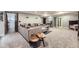 The finished basement has a cozy seating area with plush sofa, side tables, and carpeted floors at 5550 E 130Th Dr, Thornton, CO 80241
