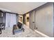 Finished basement with gray walls, gray carpet, a black futon and doors to other rooms at 5550 E 130Th Dr, Thornton, CO 80241