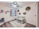 bedroom with white crib and colorful rug at 5550 E 130Th Dr, Thornton, CO 80241