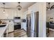 Modern kitchen featuring stainless steel appliances, white cabinets, and wood-look floors at 5550 E 130Th Dr, Thornton, CO 80241