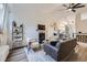 Bright living room featuring modern furniture, a fireplace, and vaulted ceilings at 5550 E 130Th Dr, Thornton, CO 80241