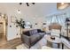 Bright living room featuring modern furniture, a fireplace, and neutral decor at 5550 E 130Th Dr, Thornton, CO 80241