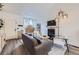Bright living room featuring modern furniture, a fireplace, and neutral decor at 5550 E 130Th Dr, Thornton, CO 80241