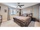 Bedroom featuring a ceiling fan, platform bed with storage, and a window at 5550 E 130Th Dr, Thornton, CO 80241