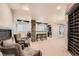 The finished basement features a bar with seating, exposed beams, and a climate-controlled wine cellar at 5660 E Burlington Dr, Castle Rock, CO 80104