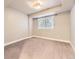 Basement bedroom featuring carpeted floors and natural light from window at 5660 E Burlington Dr, Castle Rock, CO 80104