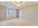 This bedroom features a ceiling fan and a window seat providing additional seating or storage space at 5660 E Burlington Dr, Castle Rock, CO 80104