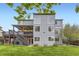 The home has a large backyard, a patio, a two-level deck, and lots of big windows at 5660 E Burlington Dr, Castle Rock, CO 80104