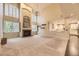 Spacious living room with fireplace, high ceilings, and windows overlooking the yard at 5660 E Burlington Dr, Castle Rock, CO 80104