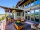 Inviting outdoor deck with seating area and views of the surrounding landscape at 3395 Timbergate Trl, Evergreen, CO 80439