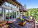 Spacious deck with mountain views, outdoor seating, offering an ideal space for outdoor entertaining or relaxation at 3395 Timbergate Trl, Evergreen, CO 80439
