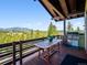 Outdoor deck with scenic view and a gas grill at 3395 Timbergate Trl, Evergreen, CO 80439