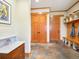 Inviting entryway with slate tile flooring, built-in storage, and a coat rack at 3395 Timbergate Trl, Evergreen, CO 80439