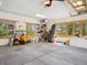 Spacious garage with plentiful natural light, storage and ample room for vehicles and projects at 3395 Timbergate Trl, Evergreen, CO 80439