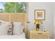 Bright bedroom featuring bedside table, natural light, and garden view at 2100 N Franklin St # 5, Denver, CO 80205