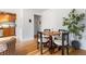 Open dining area with wood floors, a modern table setting, and natural light at 2100 N Franklin St # 5, Denver, CO 80205