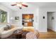 Cozy living room with an open floor plan, ceiling fan, and hardwood floors is adjacent to kitchen at 2100 N Franklin St # 5, Denver, CO 80205