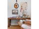 Console table is decorated with art, a lamp, and decorative objects adding charm to the living room at 2100 N Franklin St # 5, Denver, CO 80205