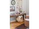 Bright living room featuring stylish decor, hardwood floors, and artistic accents at 2100 N Franklin St # 5, Denver, CO 80205