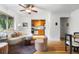 Inviting living room features an open floor plan, ceiling fan, hardwood floors, and view into kitchen at 2100 N Franklin St # 5, Denver, CO 80205