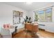 Bright modern home office with large window, stylish decor, and comfortable seating at 2100 N Franklin St # 5, Denver, CO 80205