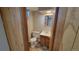 Small basement bathroom with toilet and sink at 2998 S York St, Denver, CO 80210