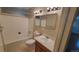 Bathroom with bathtub, toilet and double vanity at 2998 S York St, Denver, CO 80210