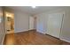 Hardwood floor bedroom with access to a full bathroom at 2998 S York St, Denver, CO 80210