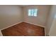 Simple bedroom featuring hardwood floors and a closet at 2998 S York St, Denver, CO 80210