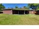 Brick house exterior with covered patio and yard at 2998 S York St, Denver, CO 80210