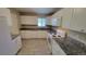 Modern kitchen with white cabinets and granite countertops at 2998 S York St, Denver, CO 80210