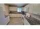 Modern kitchen with white cabinets and granite countertops at 2998 S York St, Denver, CO 80210