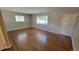 Bright living room featuring hardwood floors and large windows at 2998 S York St, Denver, CO 80210