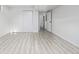 Bright basement with light gray wood-look floors and ample closet space at 2538 S Dover Way, Lakewood, CO 80227