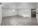 Spacious finished basement with gray flooring and recessed lighting at 2538 S Dover Way, Lakewood, CO 80227