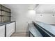 Wet bar with dark countertop and shelving at 2538 S Dover Way, Lakewood, CO 80227