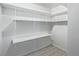 Finished basement with shelving and work surface at 2538 S Dover Way, Lakewood, CO 80227