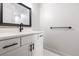 Modern bathroom with white vanity and black accents at 2538 S Dover Way, Lakewood, CO 80227