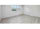 Well-lit bedroom with gray flooring and a window at 2538 S Dover Way, Lakewood, CO 80227